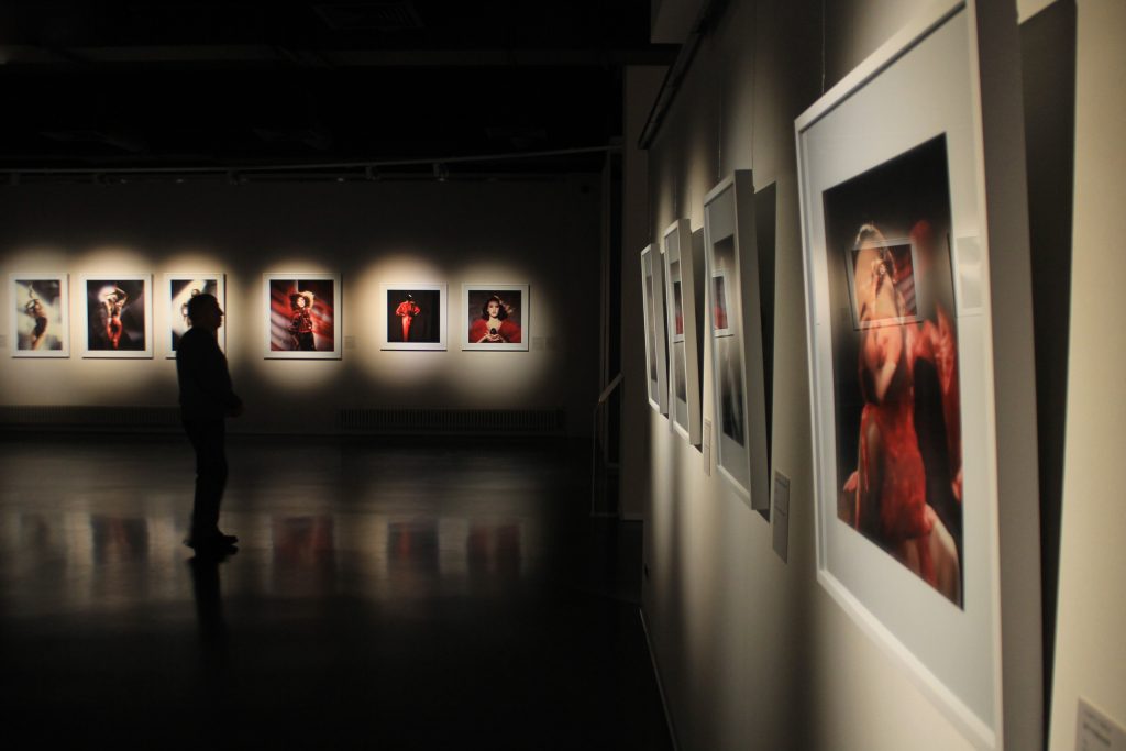 Framed artworks hung in a gallery interior