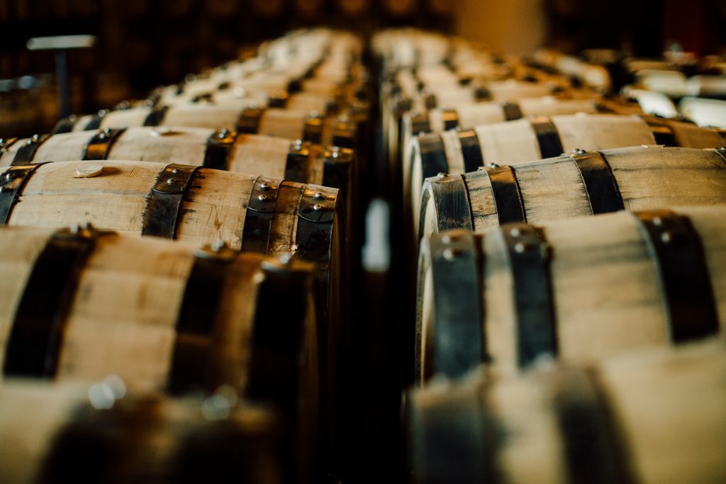 Whisky casks stacked in a bonded warehouse